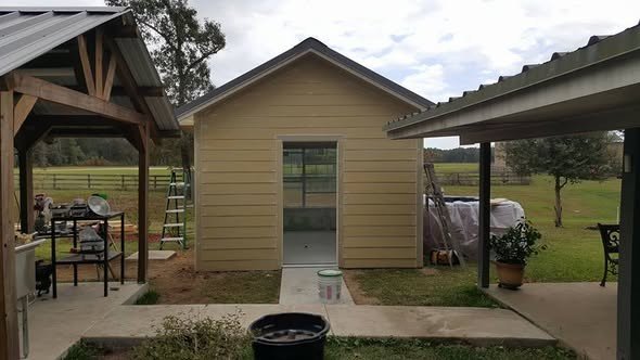 A finished home addition by Level Headed Construction — a sided structure with a covered patio in the Huffman / Lake Houston area