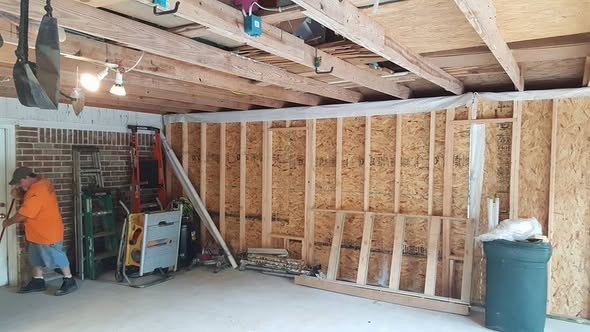 Interior framing of a home addition by Level Headed Construction — new stud walls tied into the existing structure