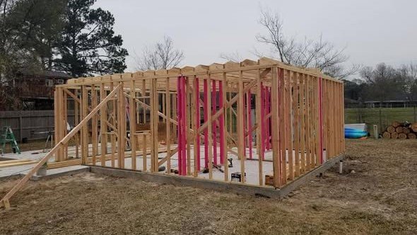 Wood wall framing on a new home build by Level Headed Construction in the Lake Houston area — braced and ready for dry-in