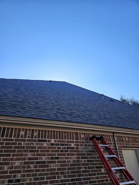 A finished charcoal asphalt-shingle roof on a brick home, re-roofed by Level Headed Construction